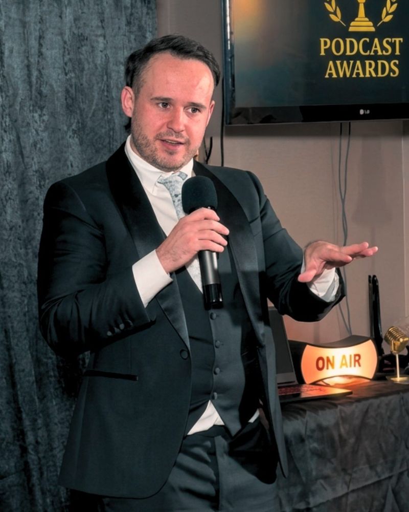 Kain giving a keynote at the International Podcast Awards